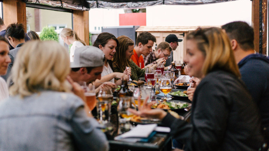 A group of people sharing a meal at a restaurant table.