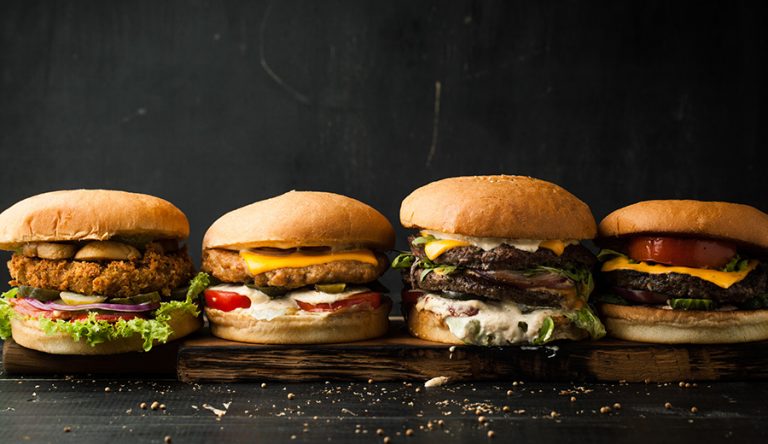a row of different types of burgers