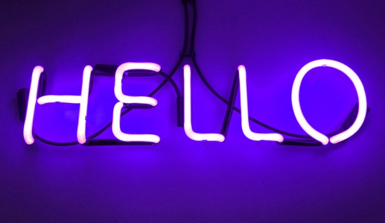 A neon sign with the word Hello