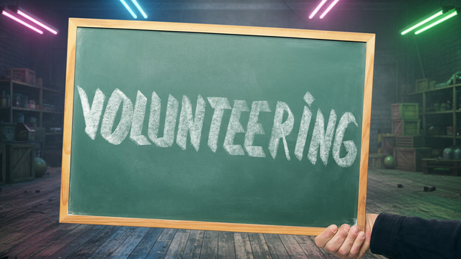 a chalkboard with the word volunteering