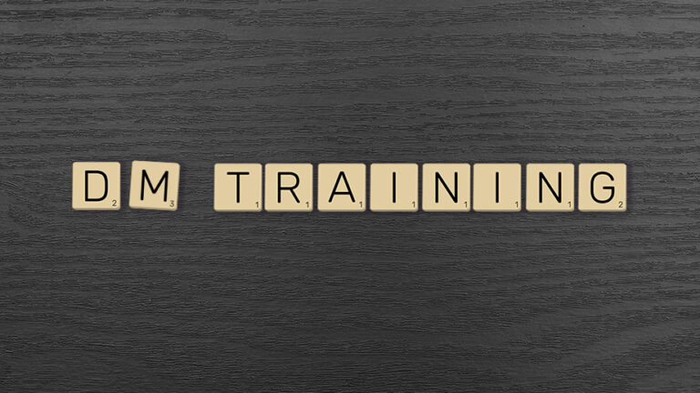 Letter tiles spelling out DM Training