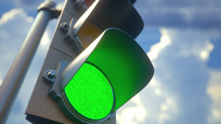 Close up of a traffic light with Green lit