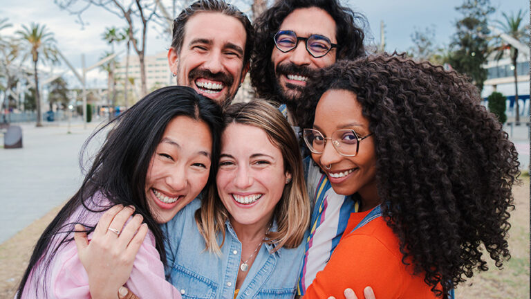 a group of happy people hugging