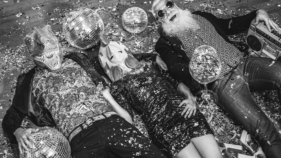 A group of people laughing on the floor on new years eve