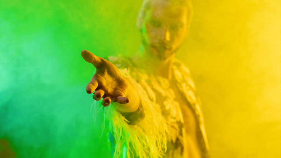 a man holds out his hand in invitation - decorative image